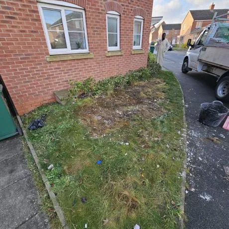 Front lawn and shrub garden clearance outside a modern brick home in Birmingham