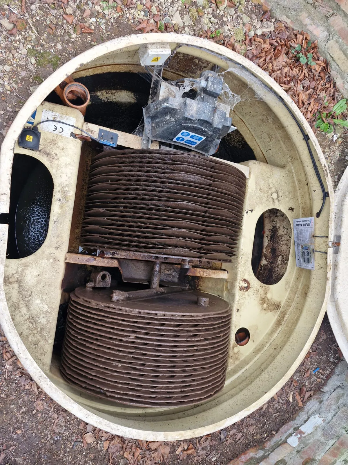 Internal view of a sewage treatment plant with rotating bio-discs being serviced by Roberts Drainage Ltd.
