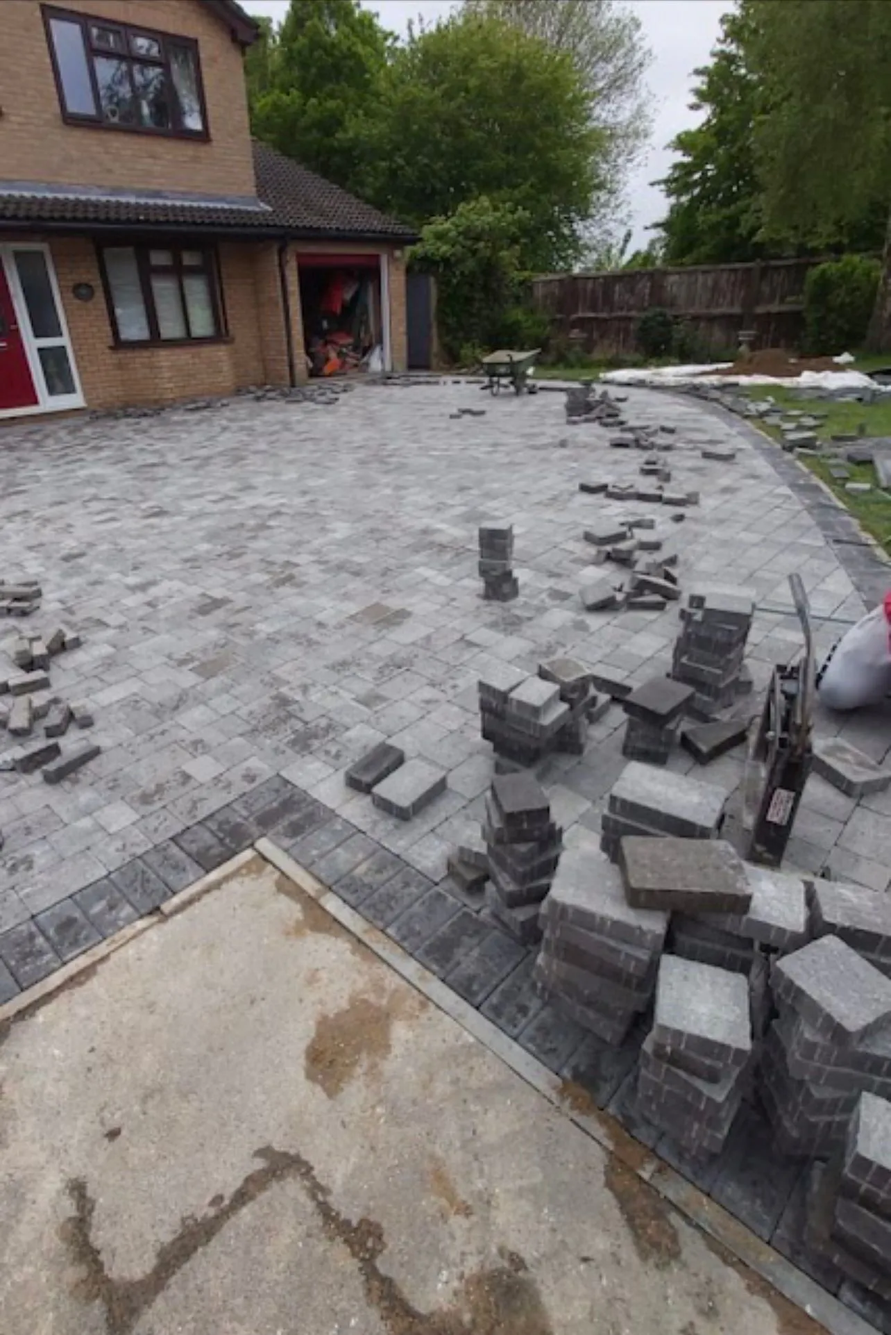 Professional installation of a grey block paving driveway by Prestige Home Improvements.