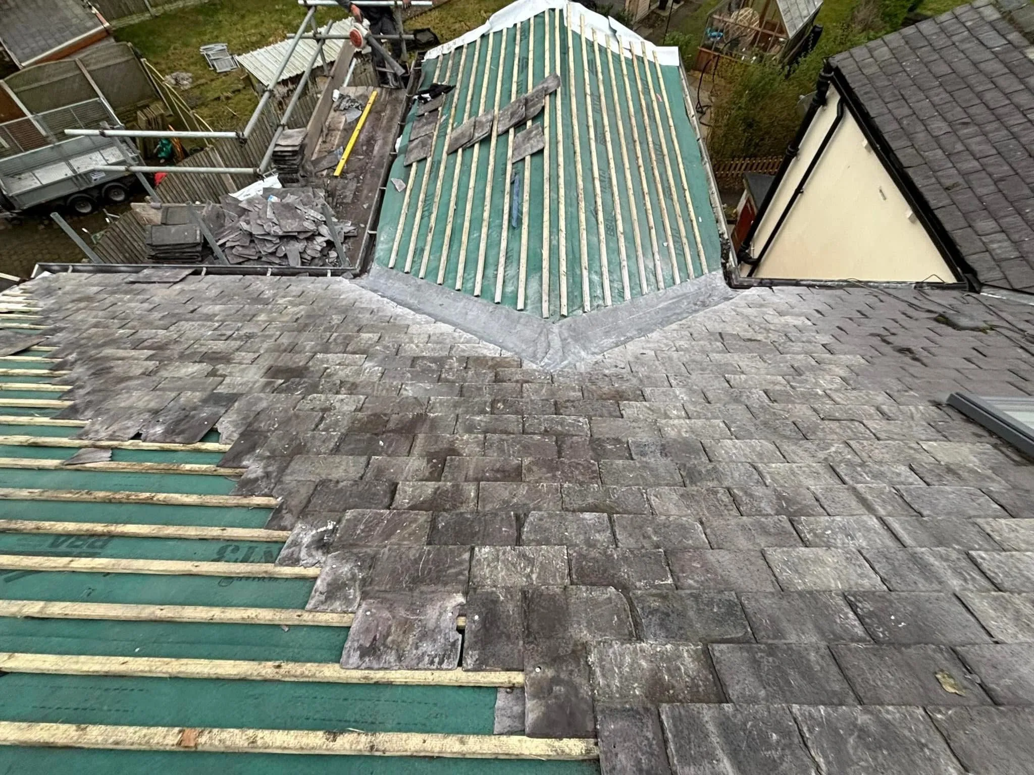 Professional slate and tile roof installation in progress featuring new battens and membrane by Lancashire Roofing Specialist.