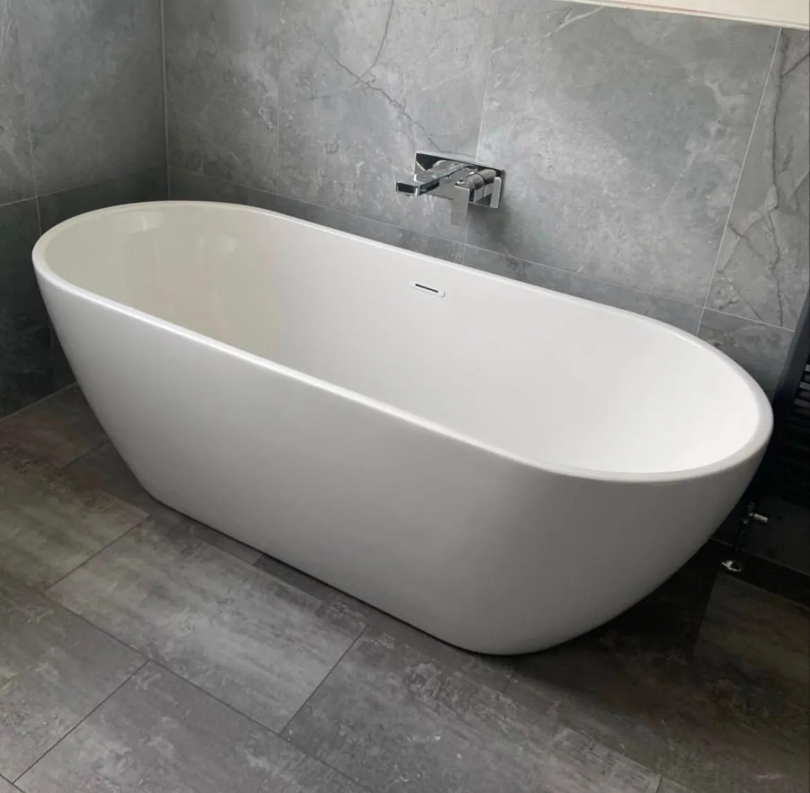 Professional freestanding bathtub installation in a York home by HM Bathroom and Heating