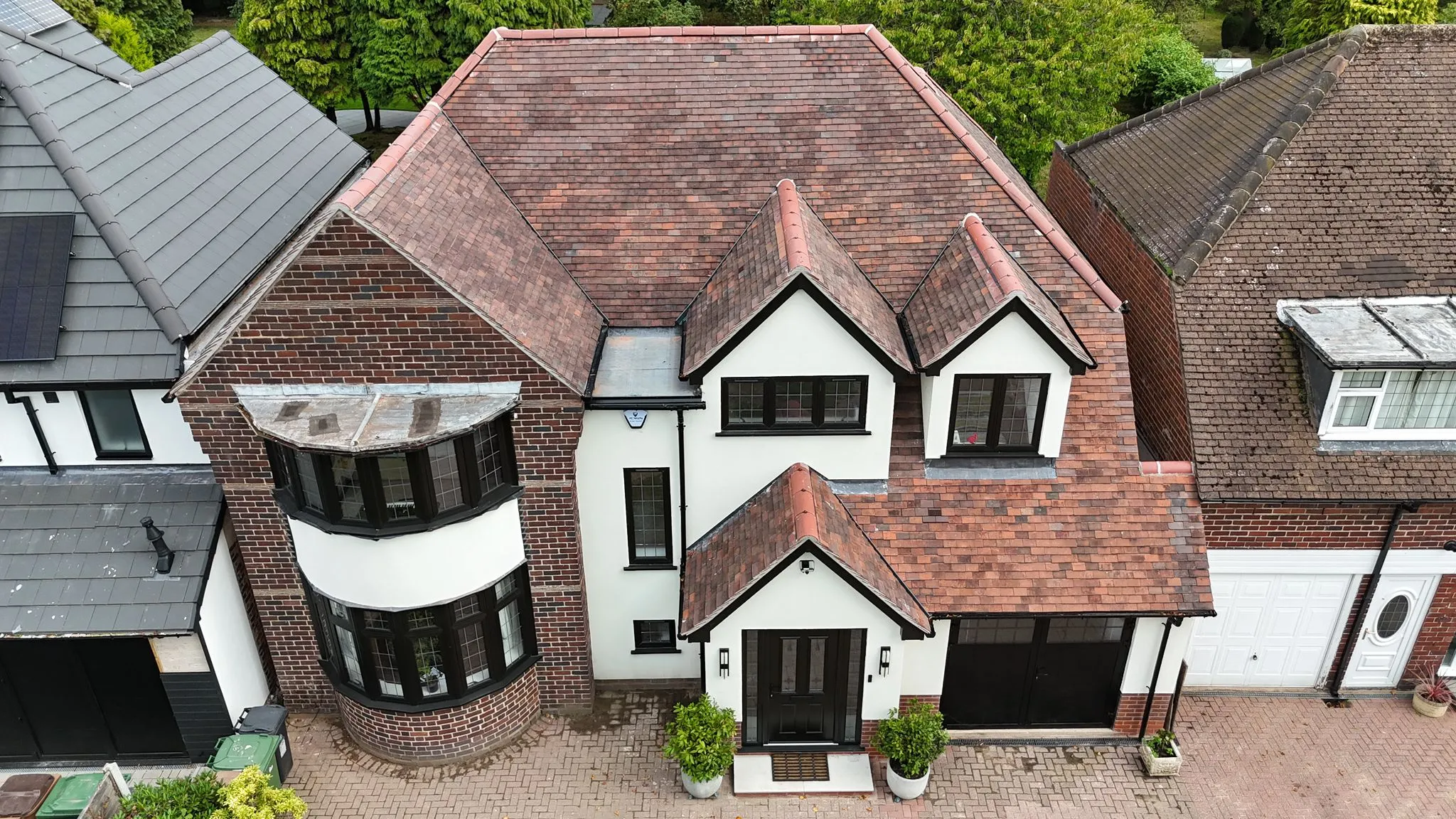 Aerial view of a beautifully designed detached house, representing a high-quality home suitable for Whites Building LTD's expert extension services.