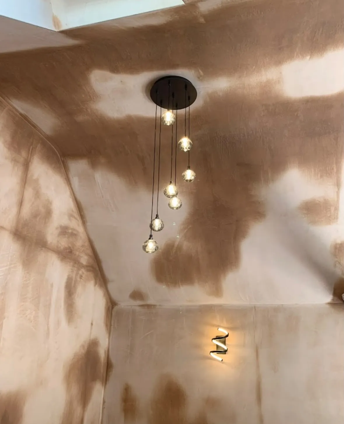 Modern multi-drop pendant feature lighting installation on a vaulted ceiling by Sussex Brown Sparks