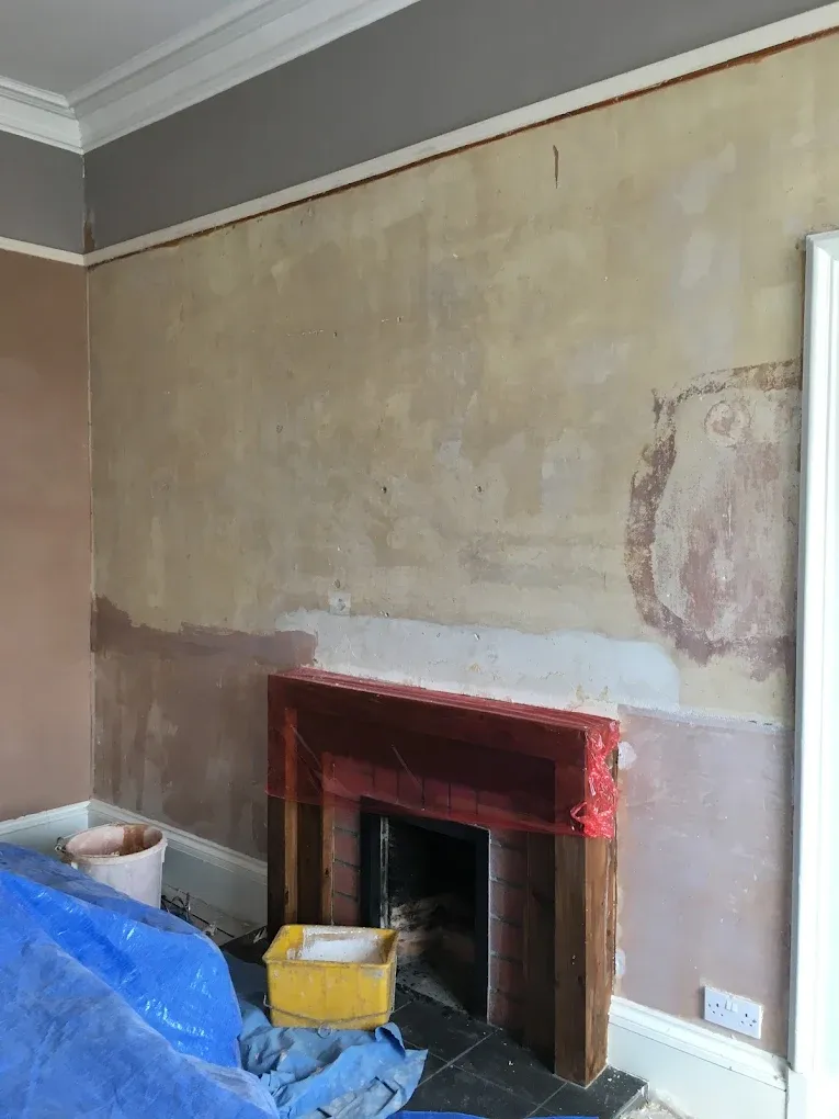 Plastering preparation work on a residential wall and fireplace in Lanark by Gordon Gardiner Slater & Plasterer.