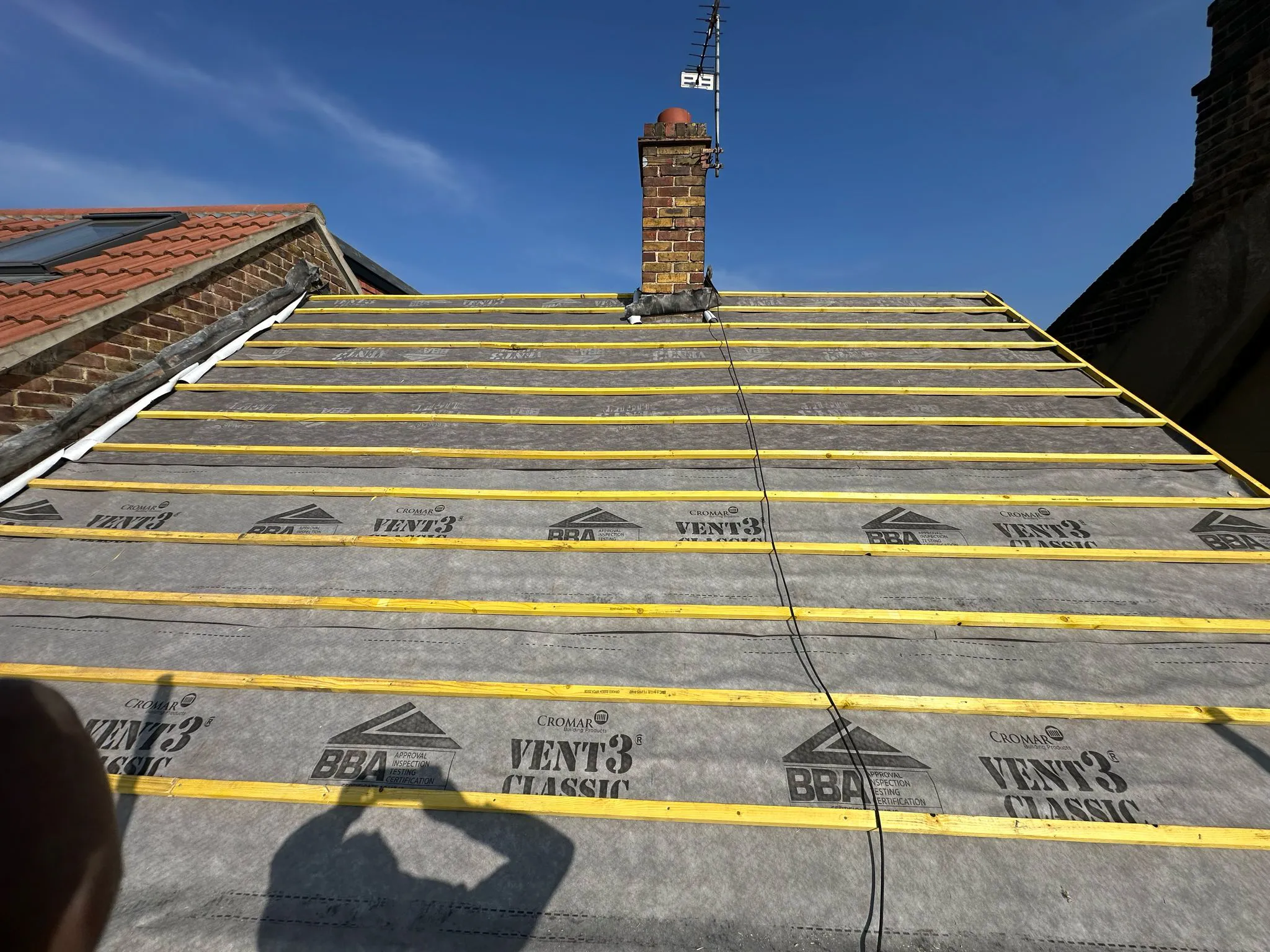 Vapour-permeable roof membrane and treated timber battens fitted on a pitched roof in Plymouth
