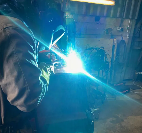 Coded welder performing precision steel welding at RA Steelworks Services LTD in Southampton.