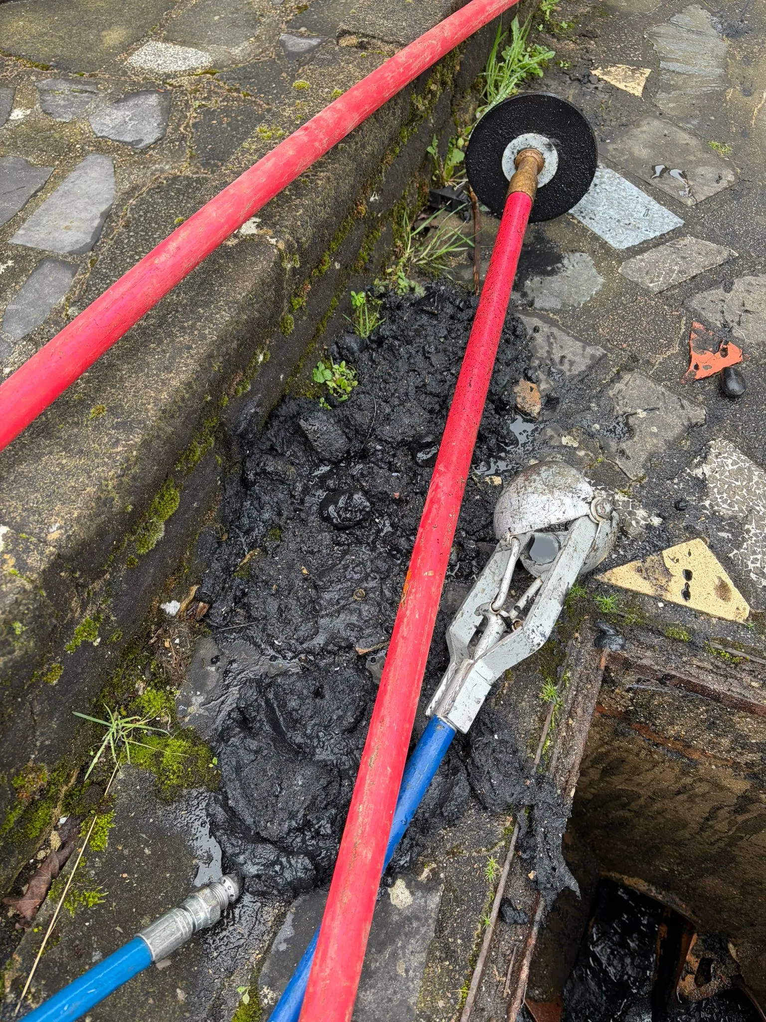 Professional drain unblocking equipment and sludge removed from a blocked drain in Slough by Buckinghamshire & Berkshire Drainage.