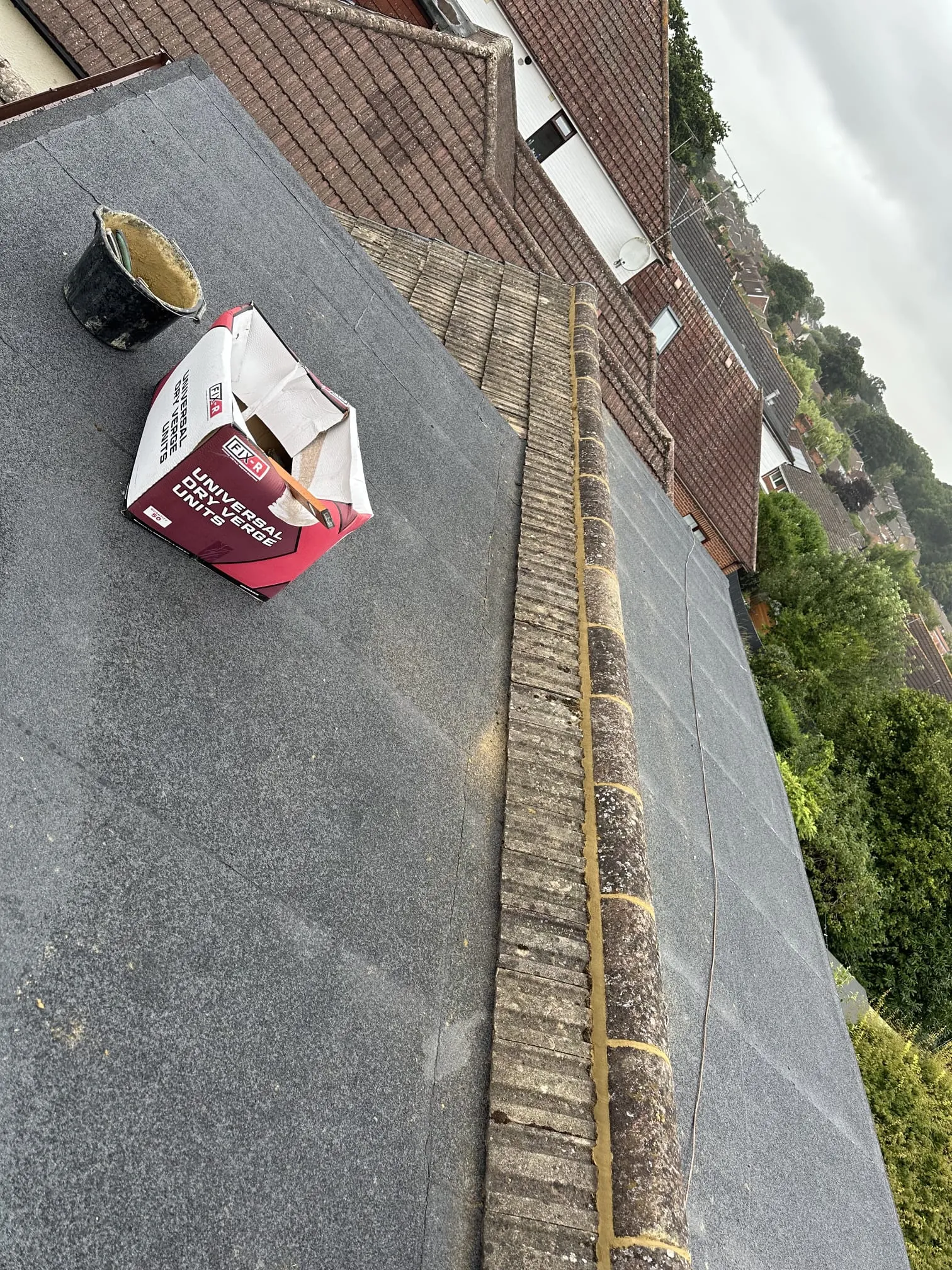 High-quality flat roof felt installation and repair work in progress by local roofers.
