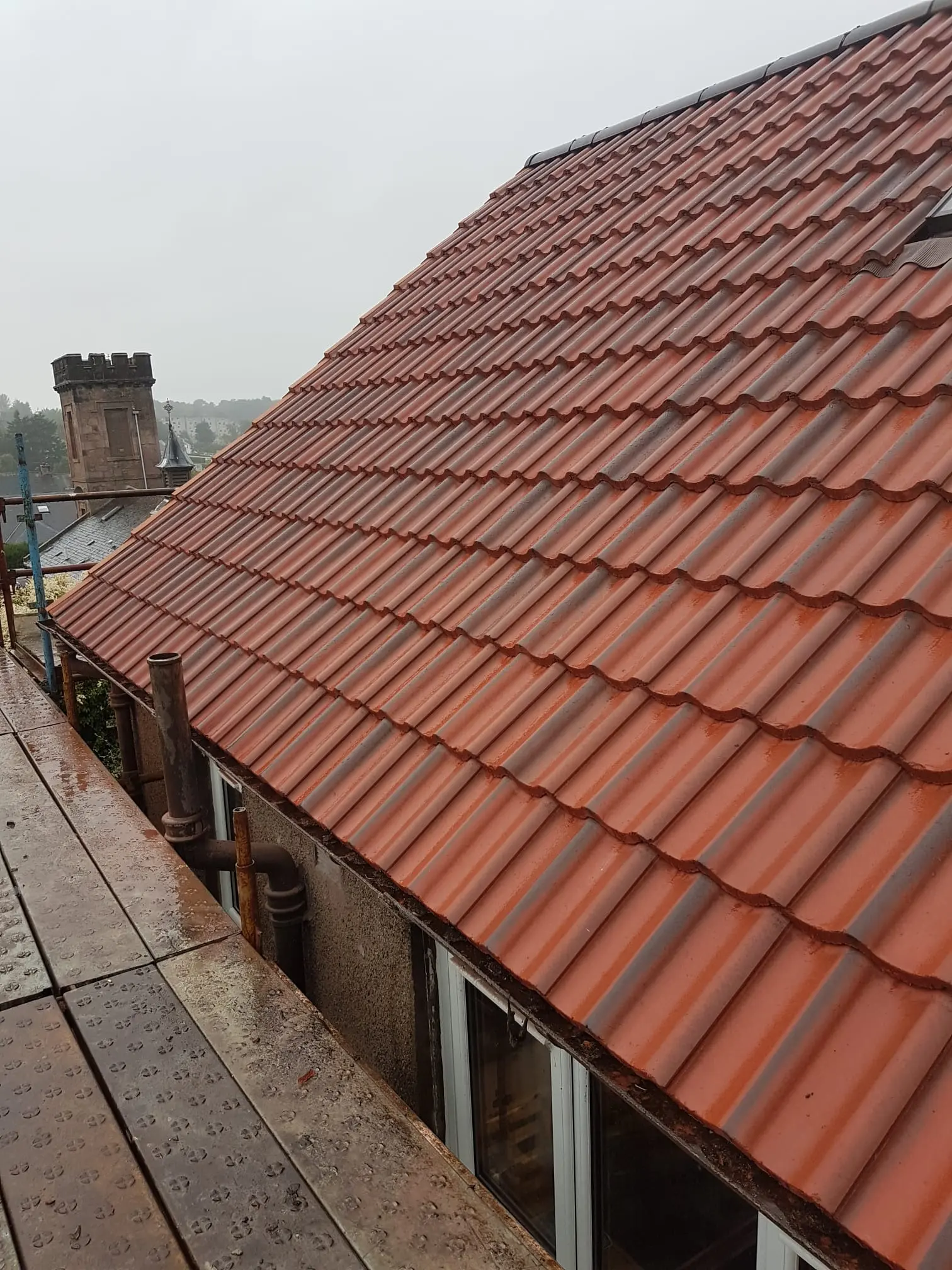 Newly installed red tiled roof in Fife by RM & SON ROOFING & PROPERTY CARE