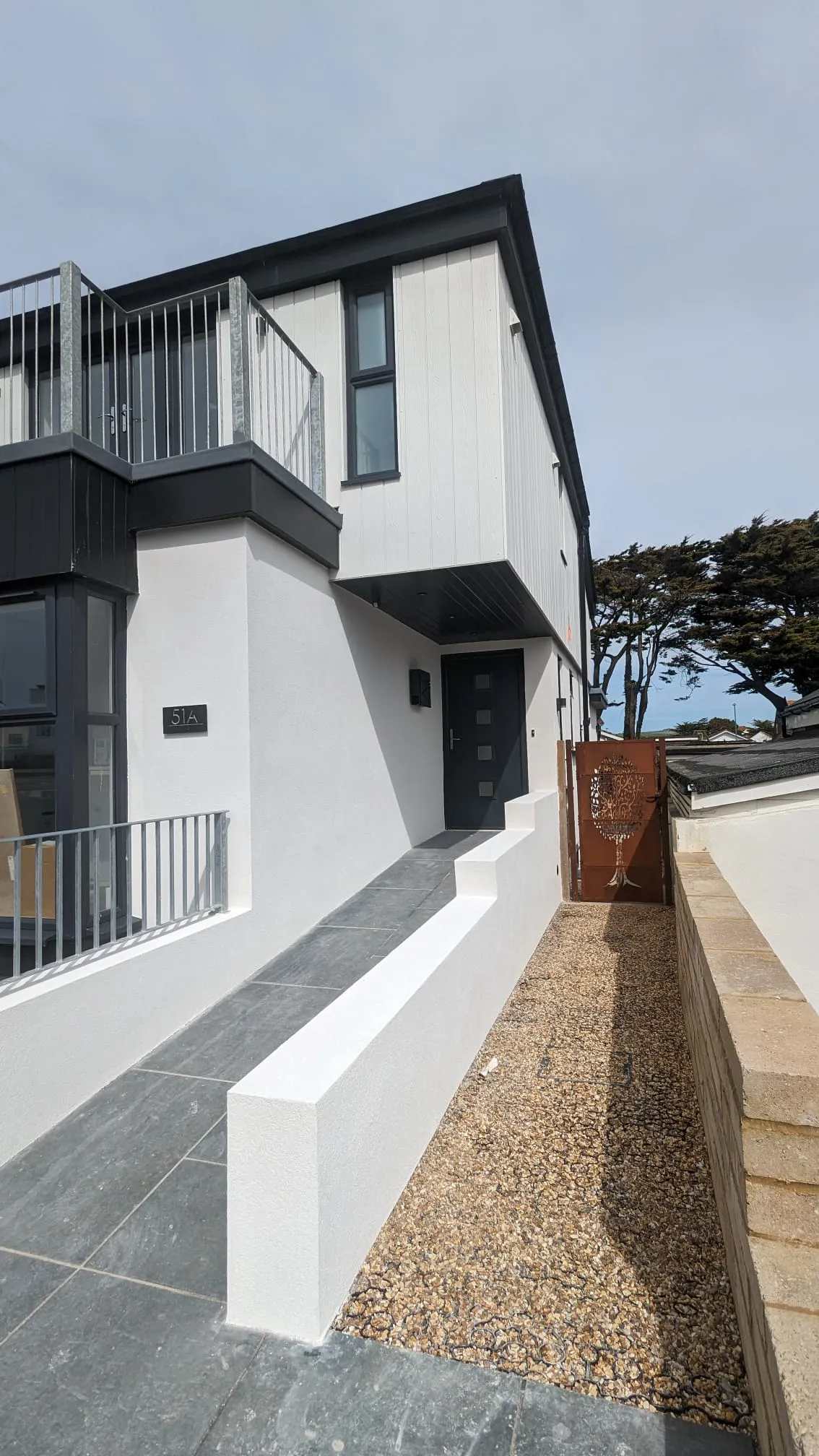 Professional white external rendering on a modern house in Southwick, completed by Portslade Plastering.