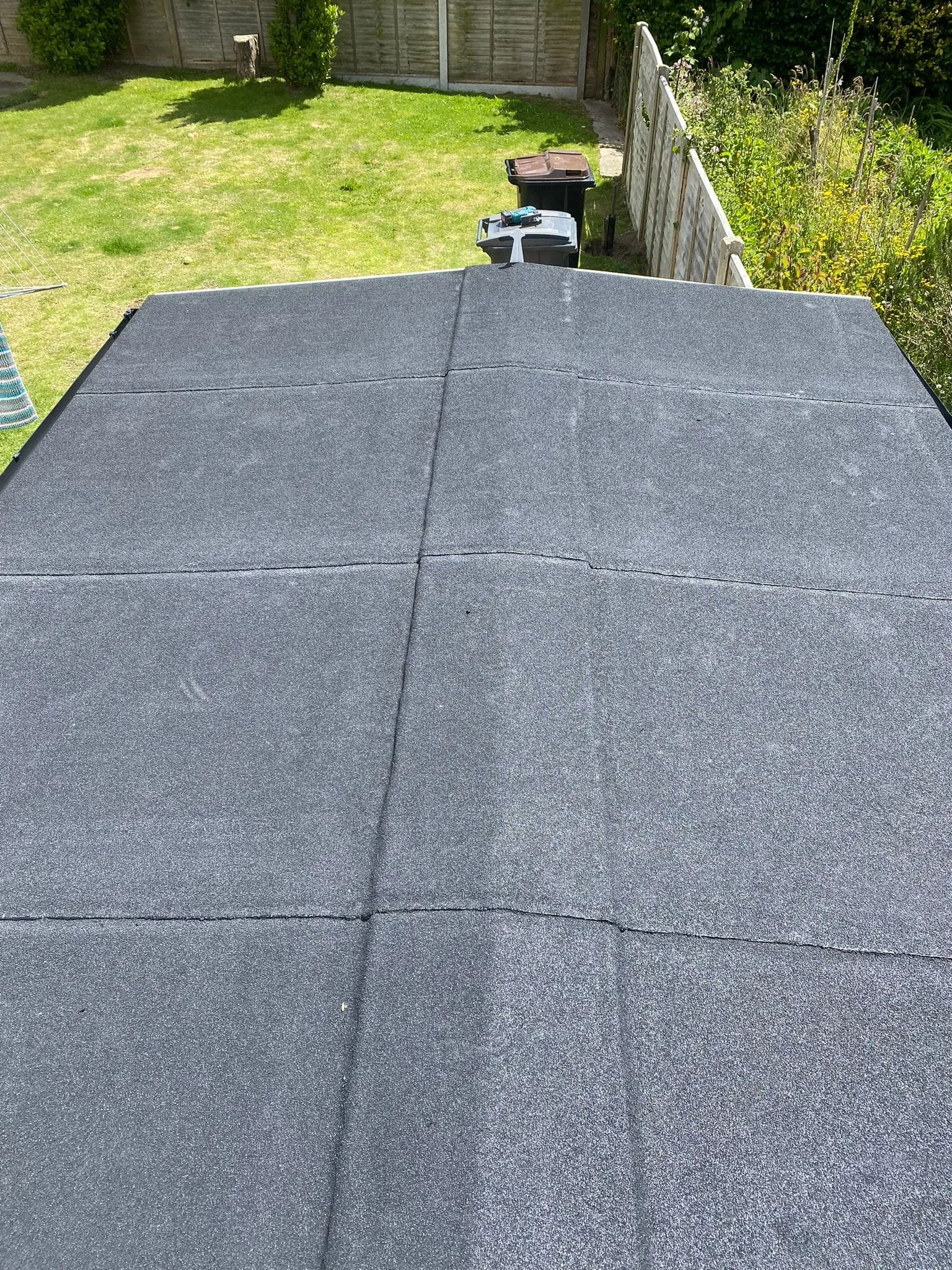 Newly installed mineral felt roof on a domestic outbuilding