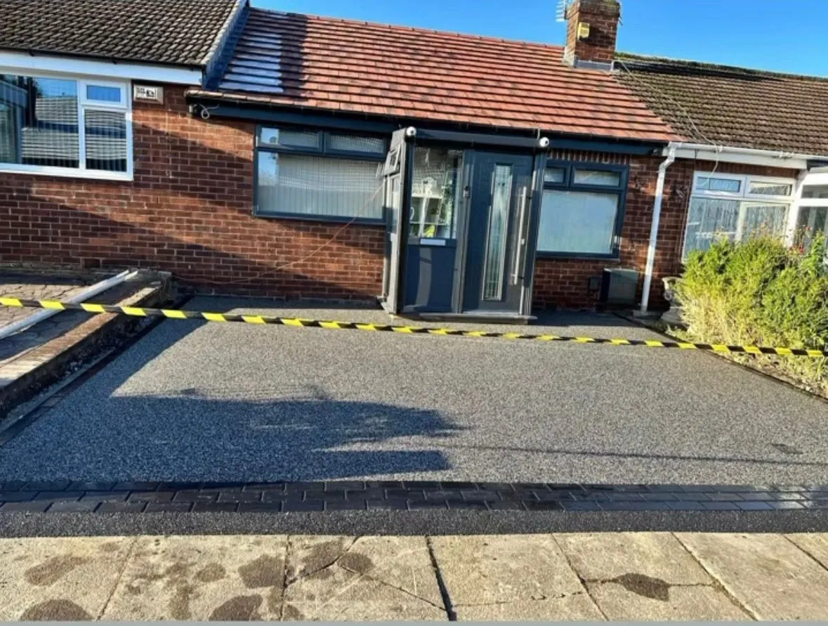 Newly installed resin bound driveway in Essex by Foster and Sons Landscaping