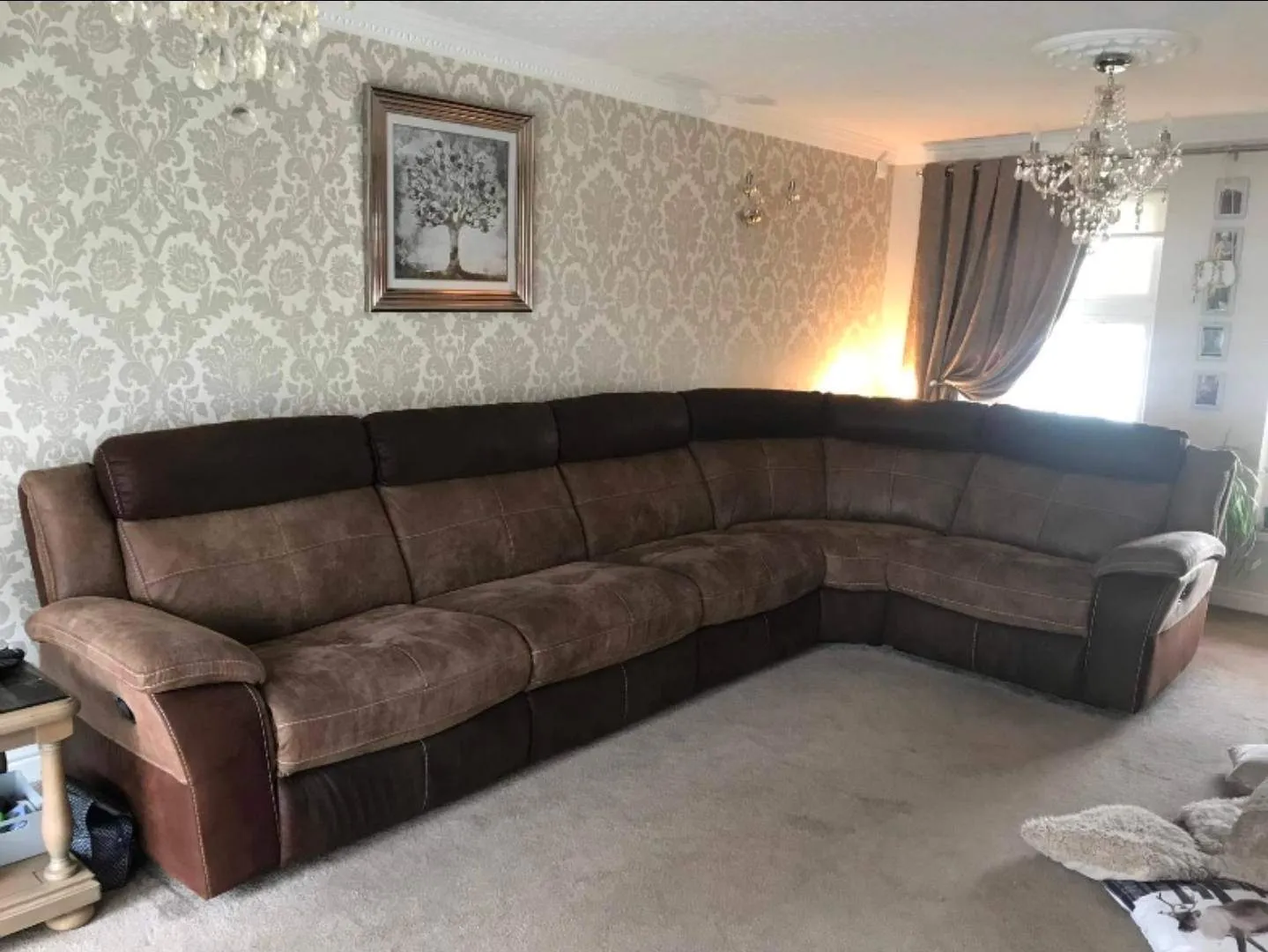 Brown modular corner sofa in a domestic living room ready for furniture recycling or house clearance