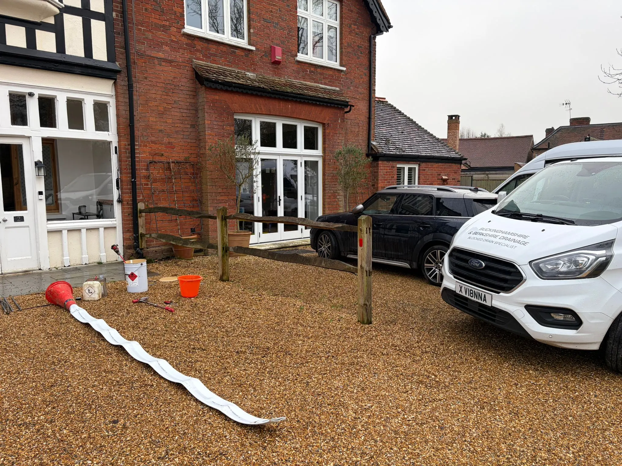 Professional drain lining and no-dig drain repair being performed by Buckinghamshire & Berkshire Drainage on a residential driveway.