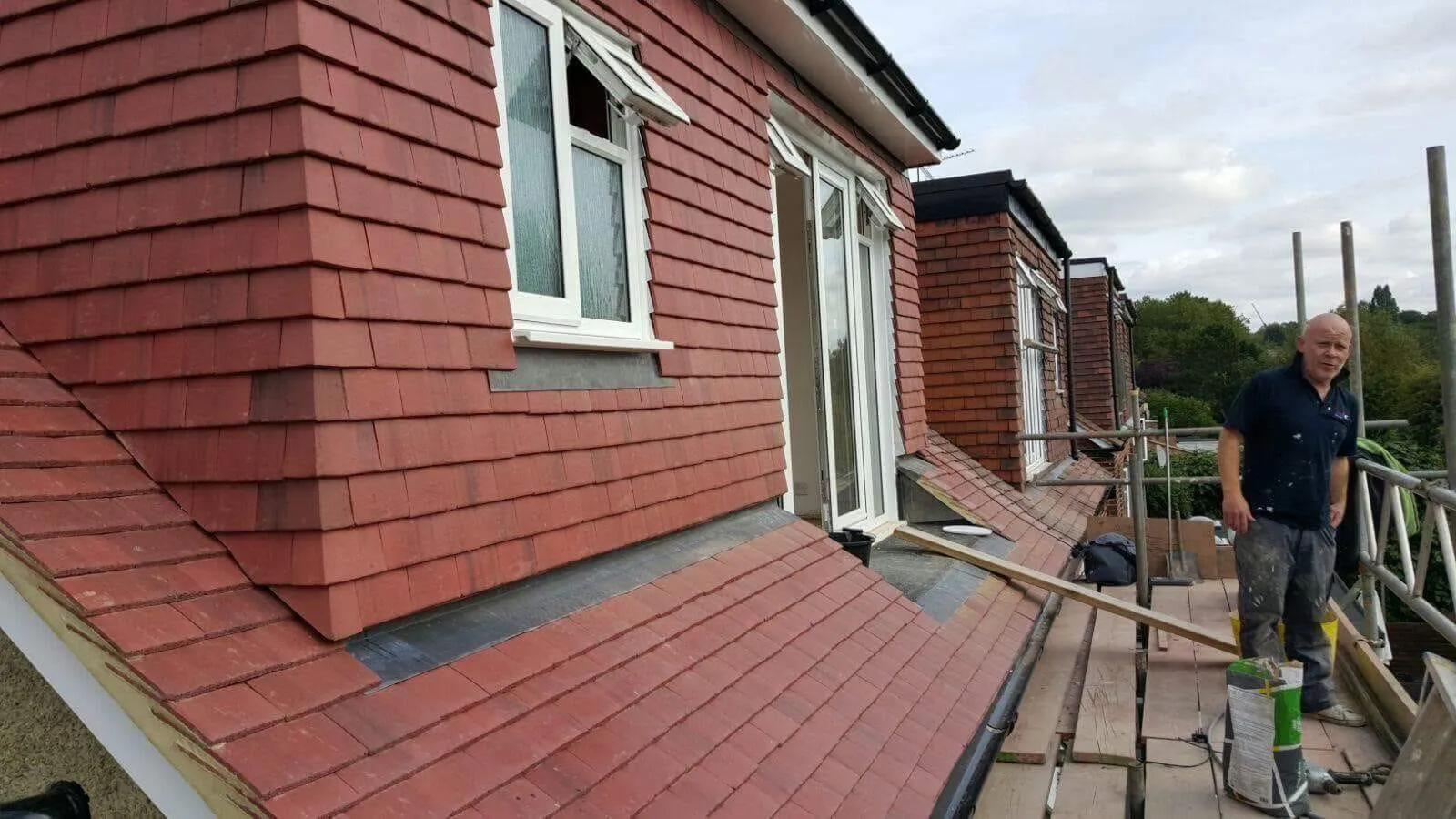 Dormer loft conversion with vertical tile-hanging and leadwork by Firmus Roofing & Building in Aylesbury.