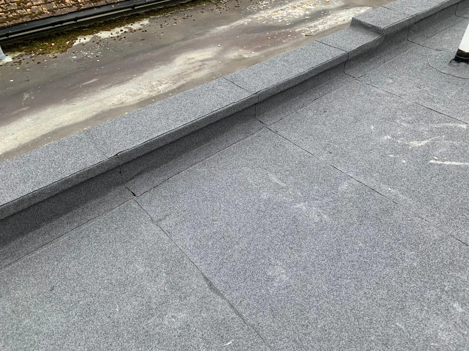 High-performance torch-on mineral felt flat roofing installation with secure upstand detailing in Whitstable