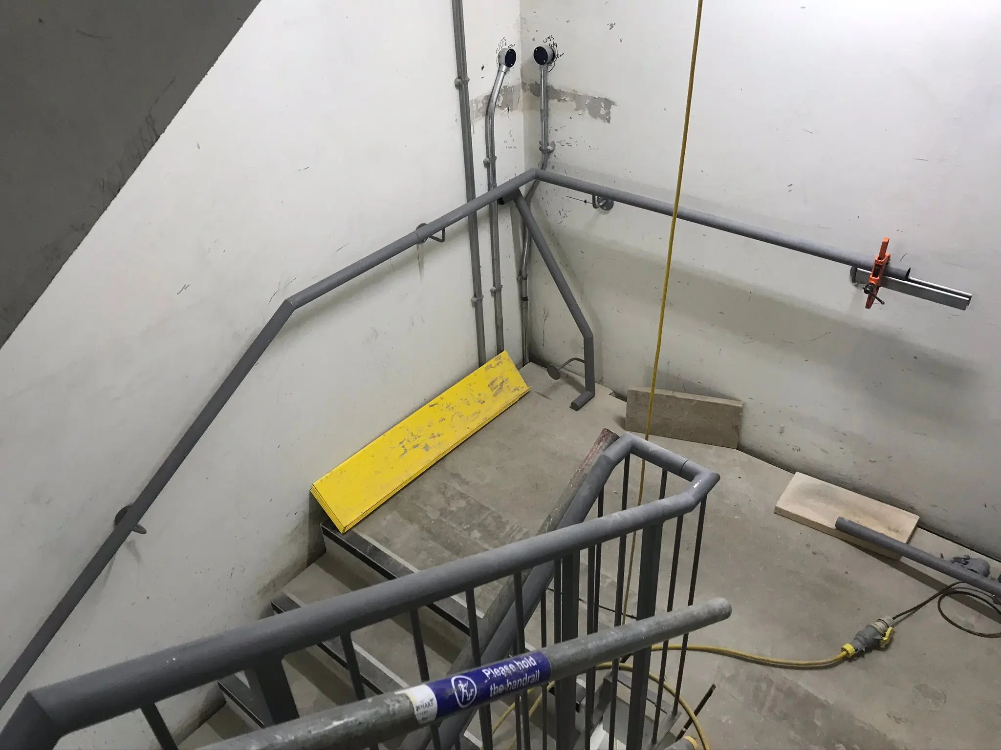Metal handrail installation and concrete stairwell construction in a commercial industrial unit by ER3 Group LTD