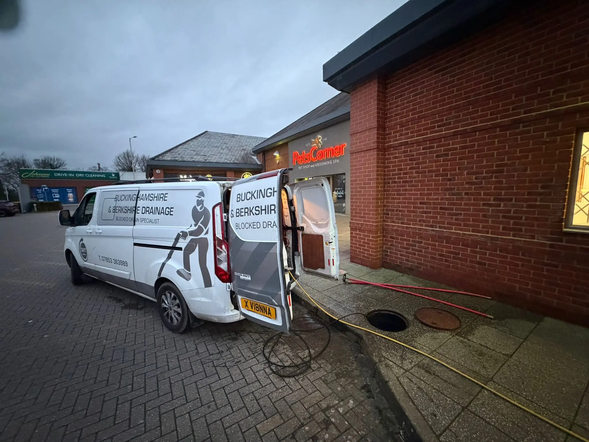 Buckinghamshire & Berkshire Drainage providing commercial drainage services and emergency drain unblocking in a retail park.