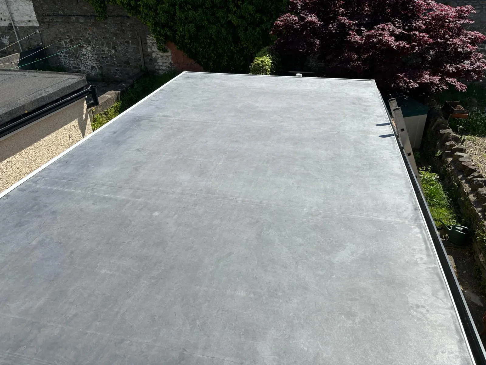 Professional flat roof installation by PRS Roofing on a residential extension.