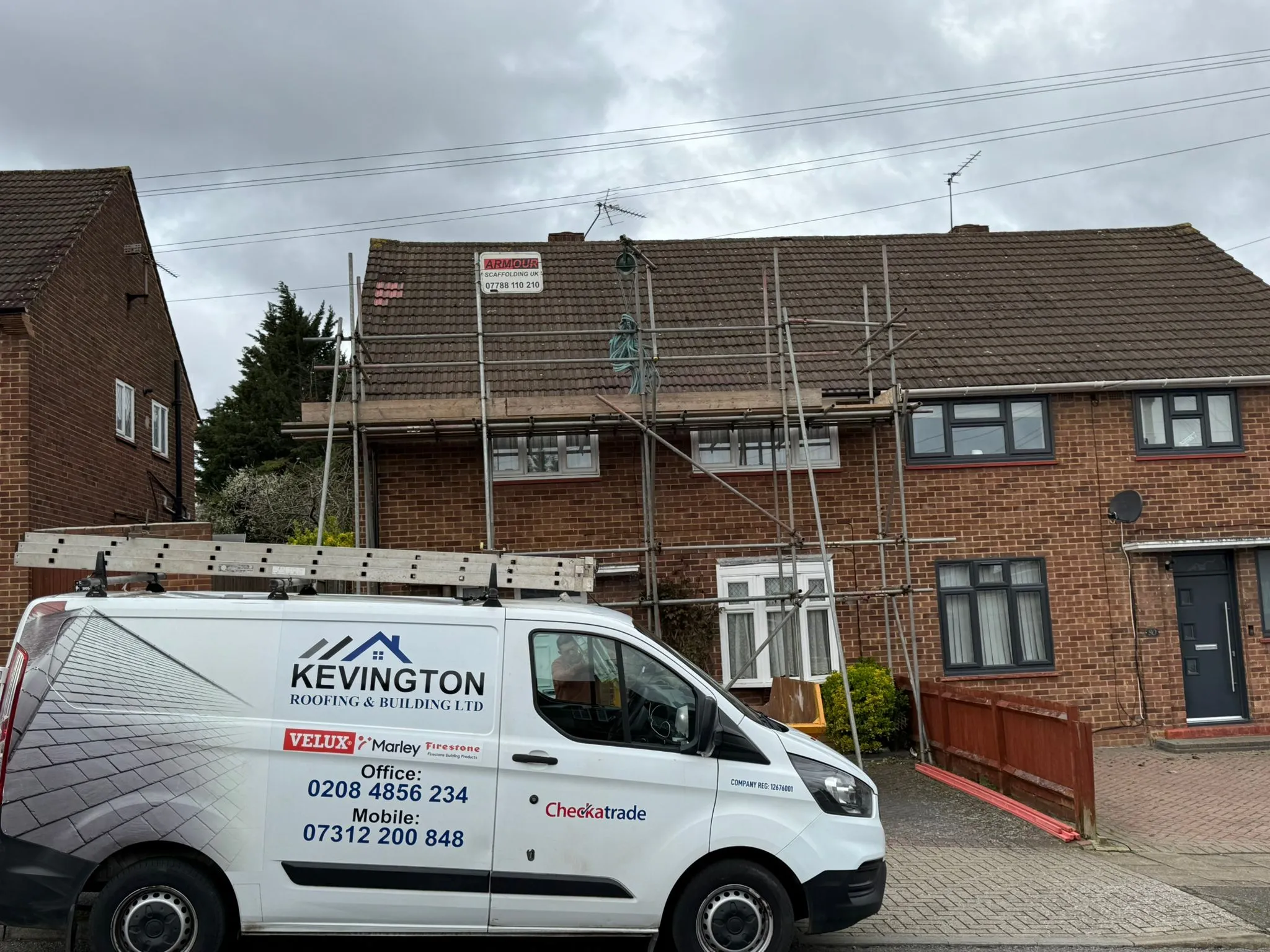 Kevington Roofing and Building LTD van parked at a residential property with roof scaffolding