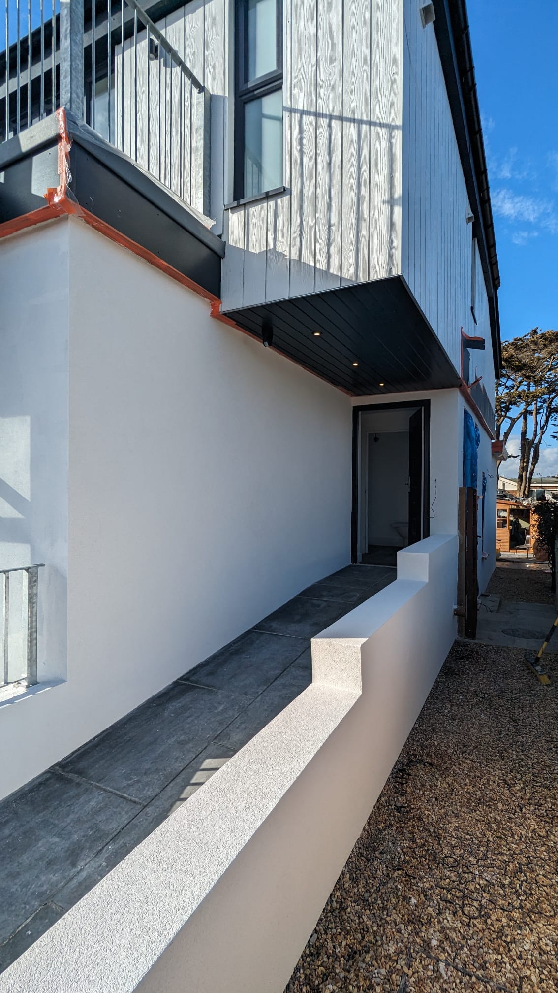 High-quality white external rendering on a modern residential property by Portslade Plastering.