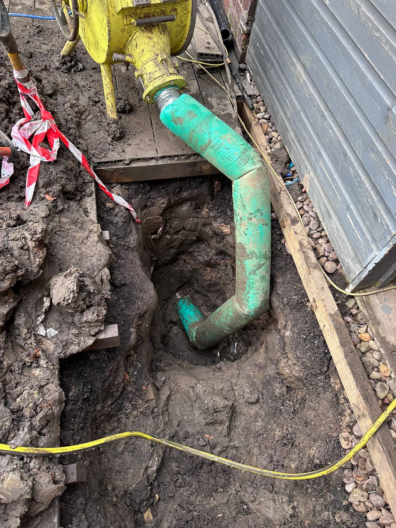 Engineers performing no-dig drain lining and repairs to a damaged pipe in Macclesfield.
