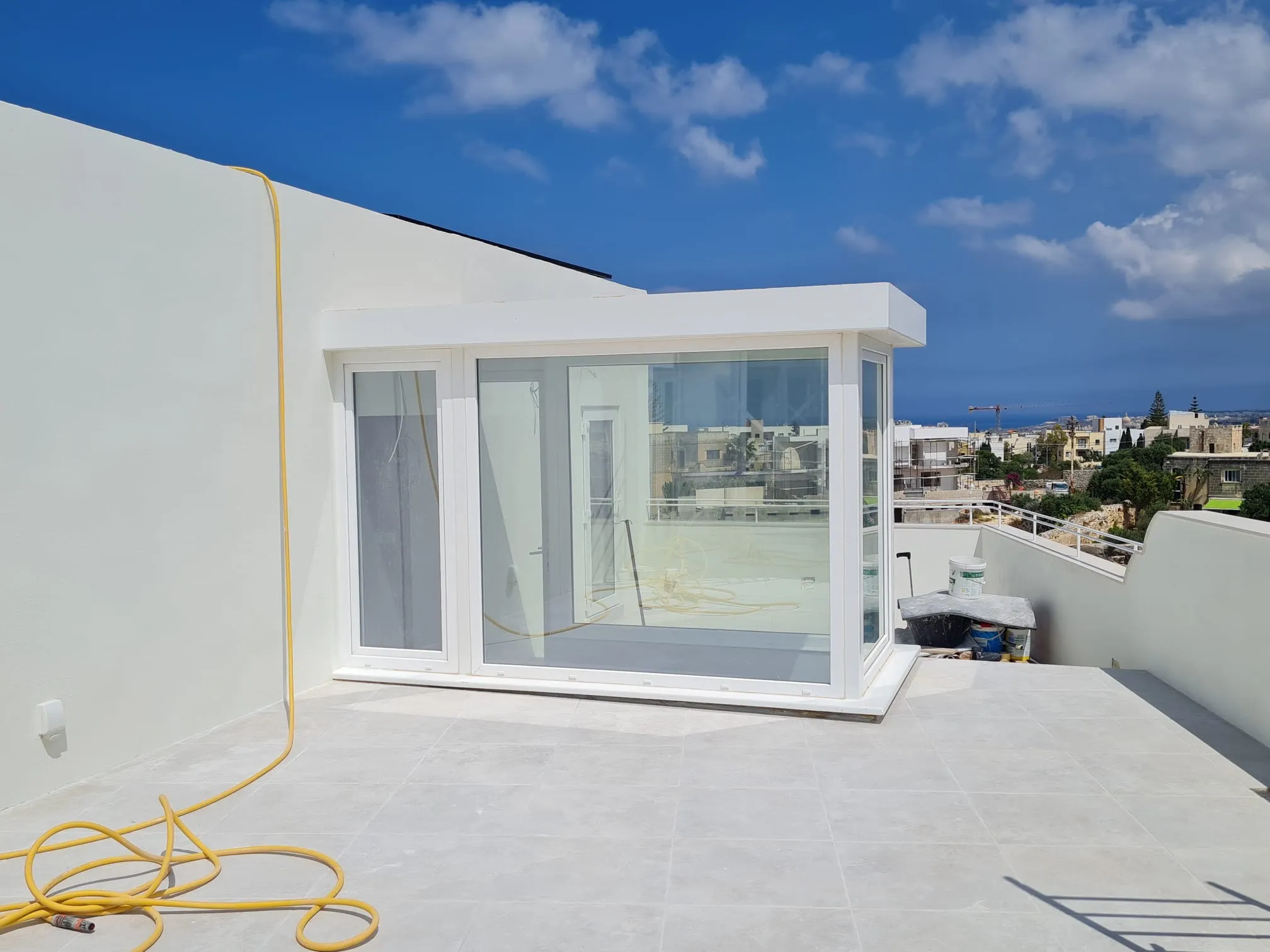 Bespoke glass and steel sunroom extension on a rooftop terrace by RA Steelworks Services LTD