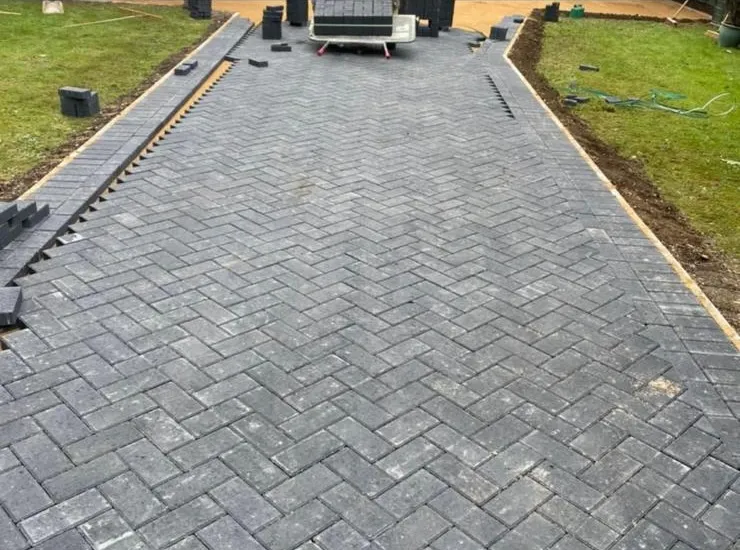 Grey block paving driveway installation in progress