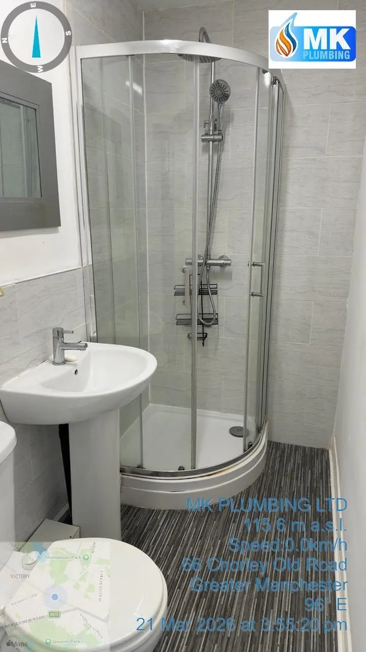 Modern bathroom plumbing installation in Greater Manchester by MK Plumbing LTD featuring a new shower and sink unit.
