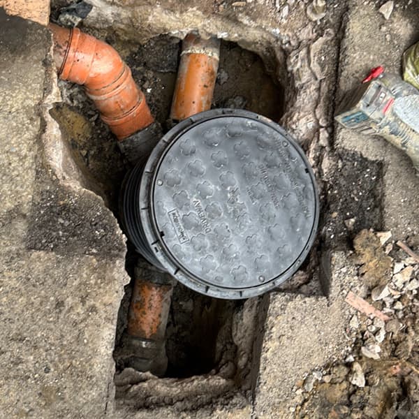 Expert drain excavation and structural sewer repair showing a newly installed inspection chamber by Drain Medics