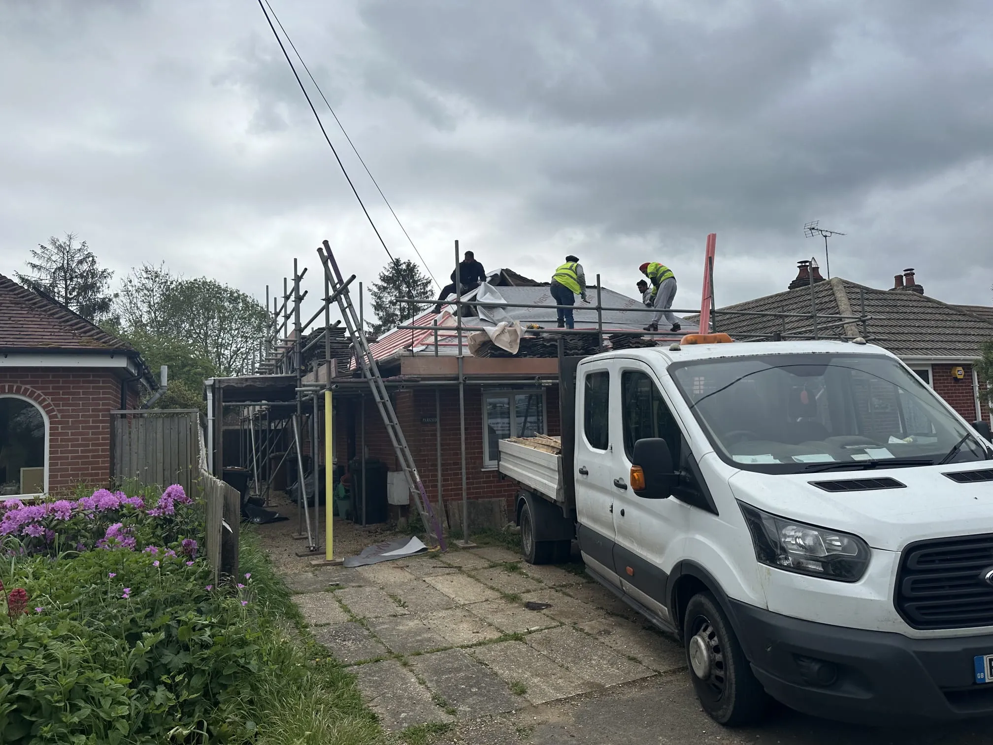 Expert roofing team installing a new tiled roof on a house in Portsmouth and Hampshire.