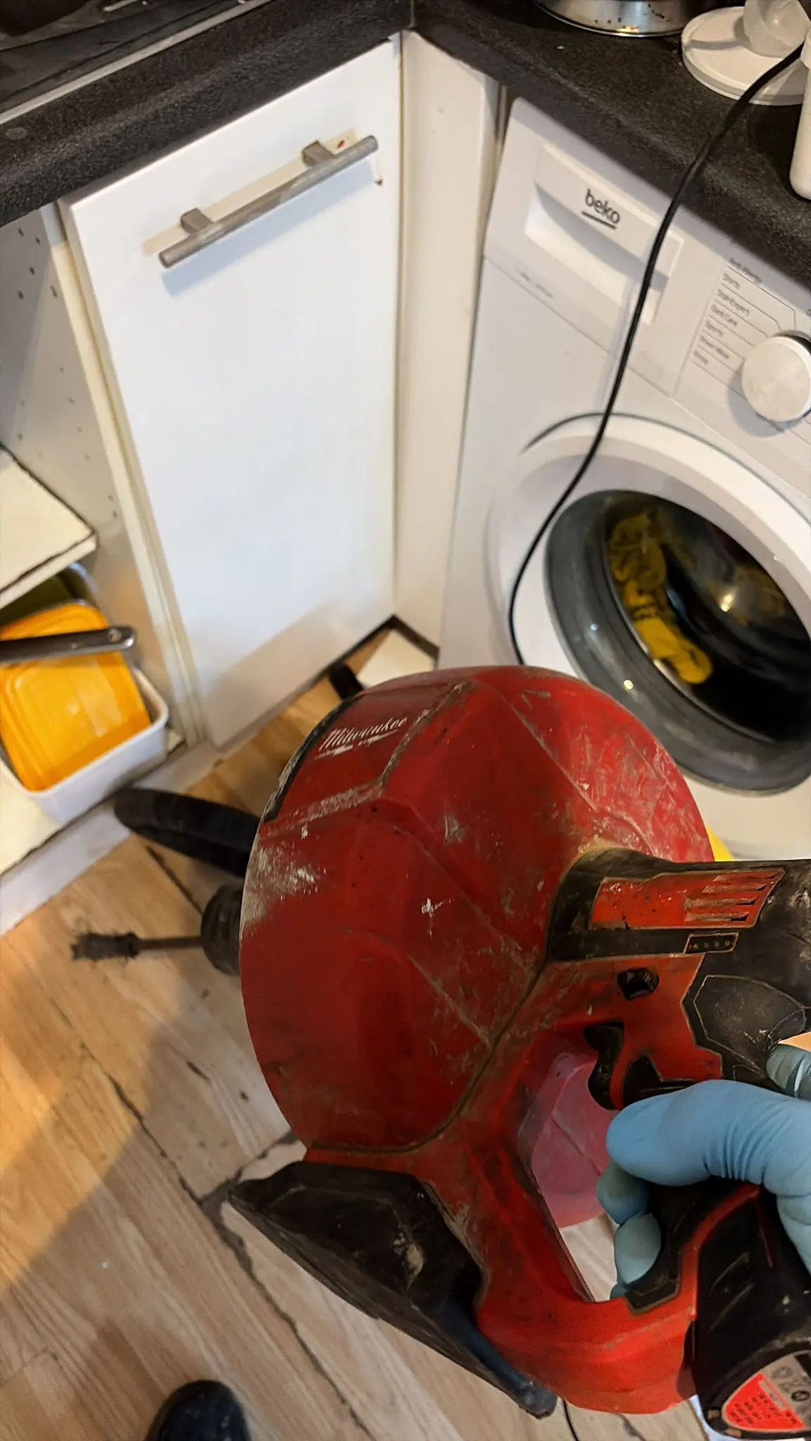 Professional drain unblocking tool being used to clear a blocked sink in Slough