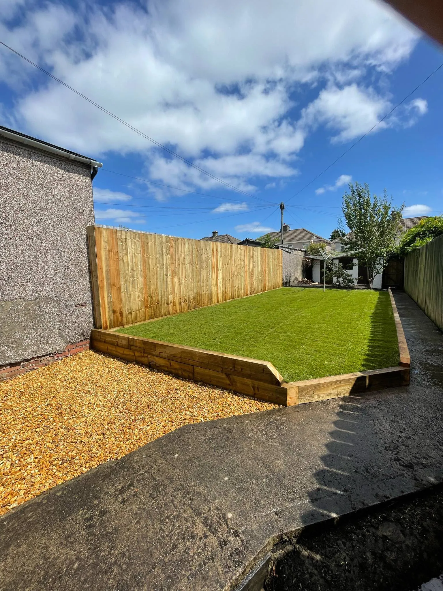 Pressure-treated vertical featheredge boundary fence installation by JDP Outdoor Solutions