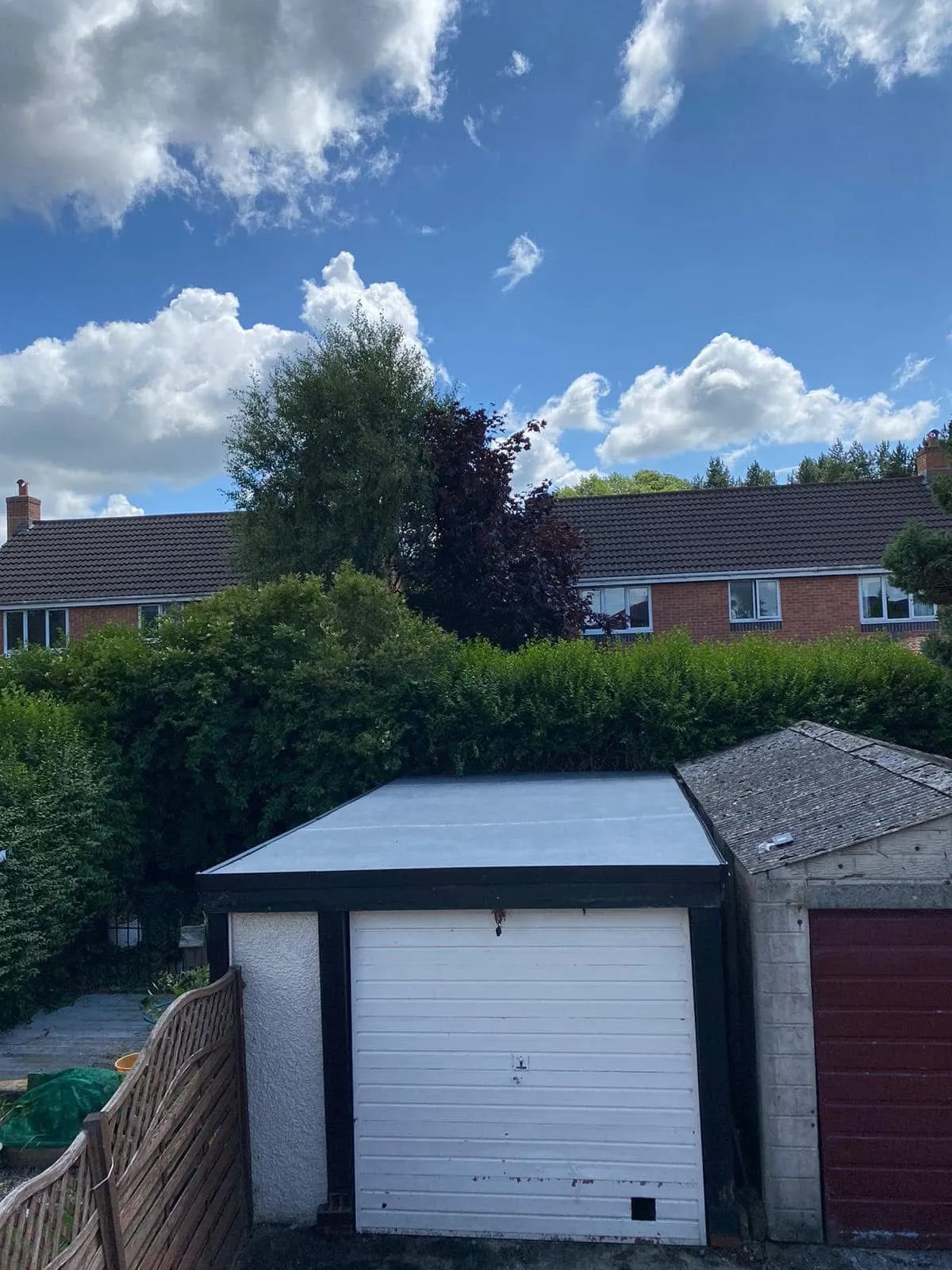 Newly installed grey flat roof on a garage by Lancashire Roofing Specialist