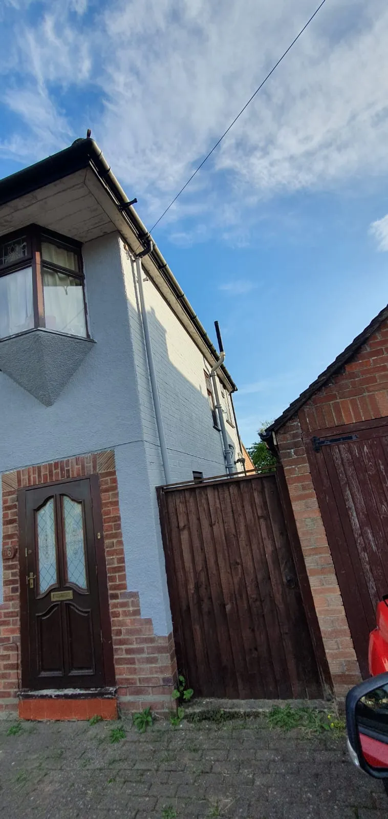Residential property exterior in Suffolk showing rendered walls and maintenance work by FLEX PROPERTY SERVICES