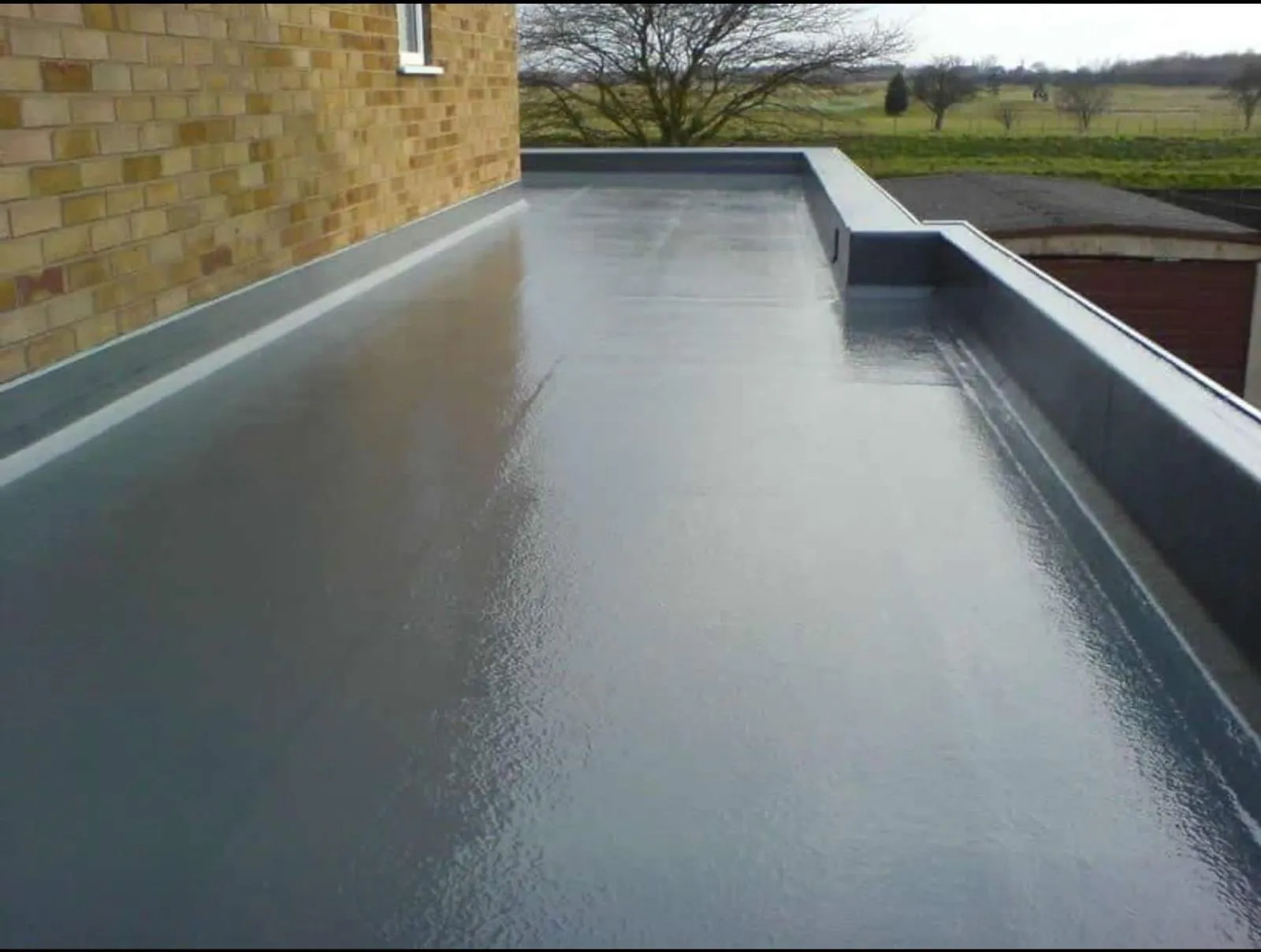 Modern grey flat roof replacement in Aylesbury featuring a seamless waterproof membrane.
