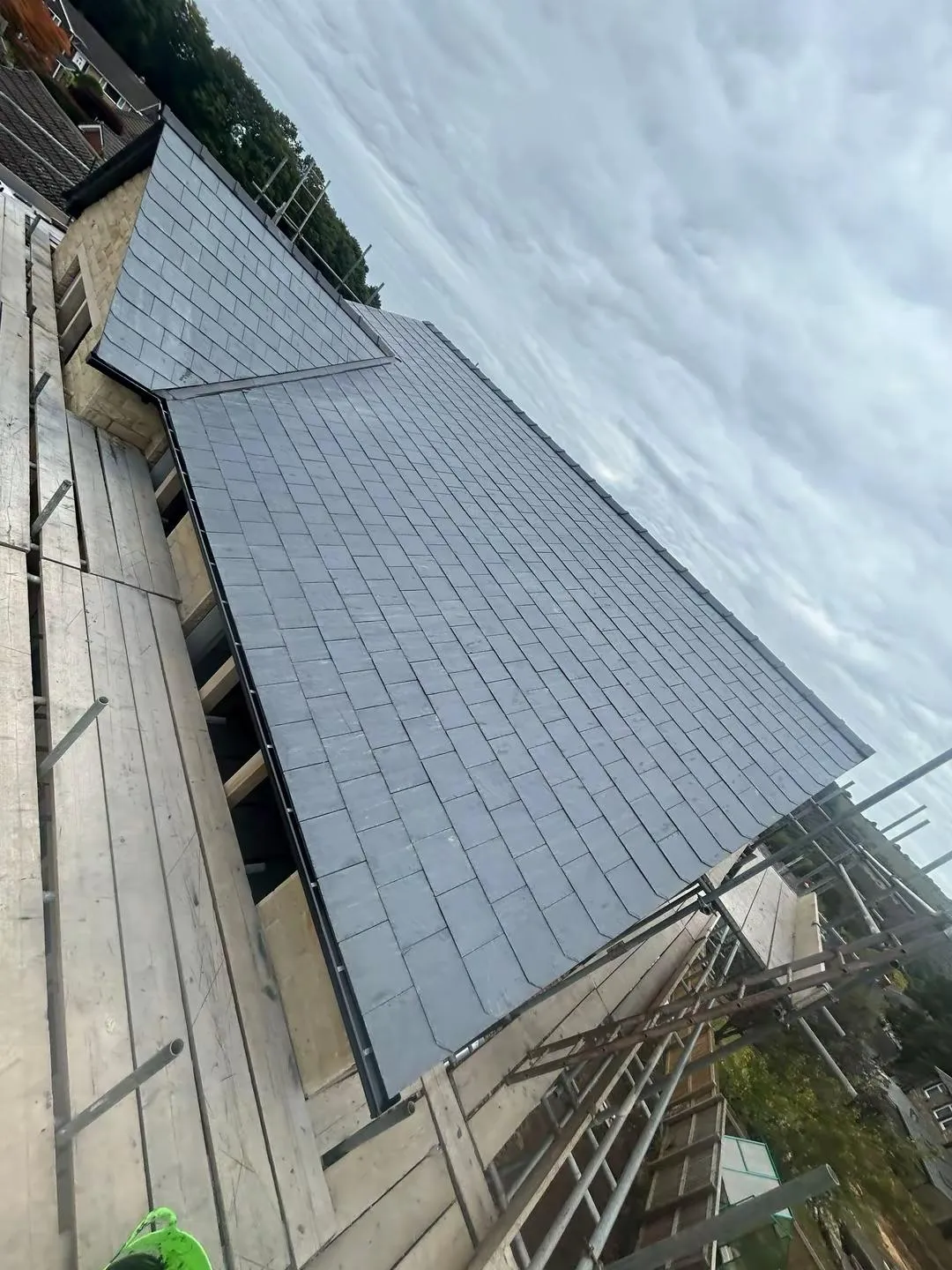 A newly installed slate roof in Holmfirth by Tyler’s Roofing Services.