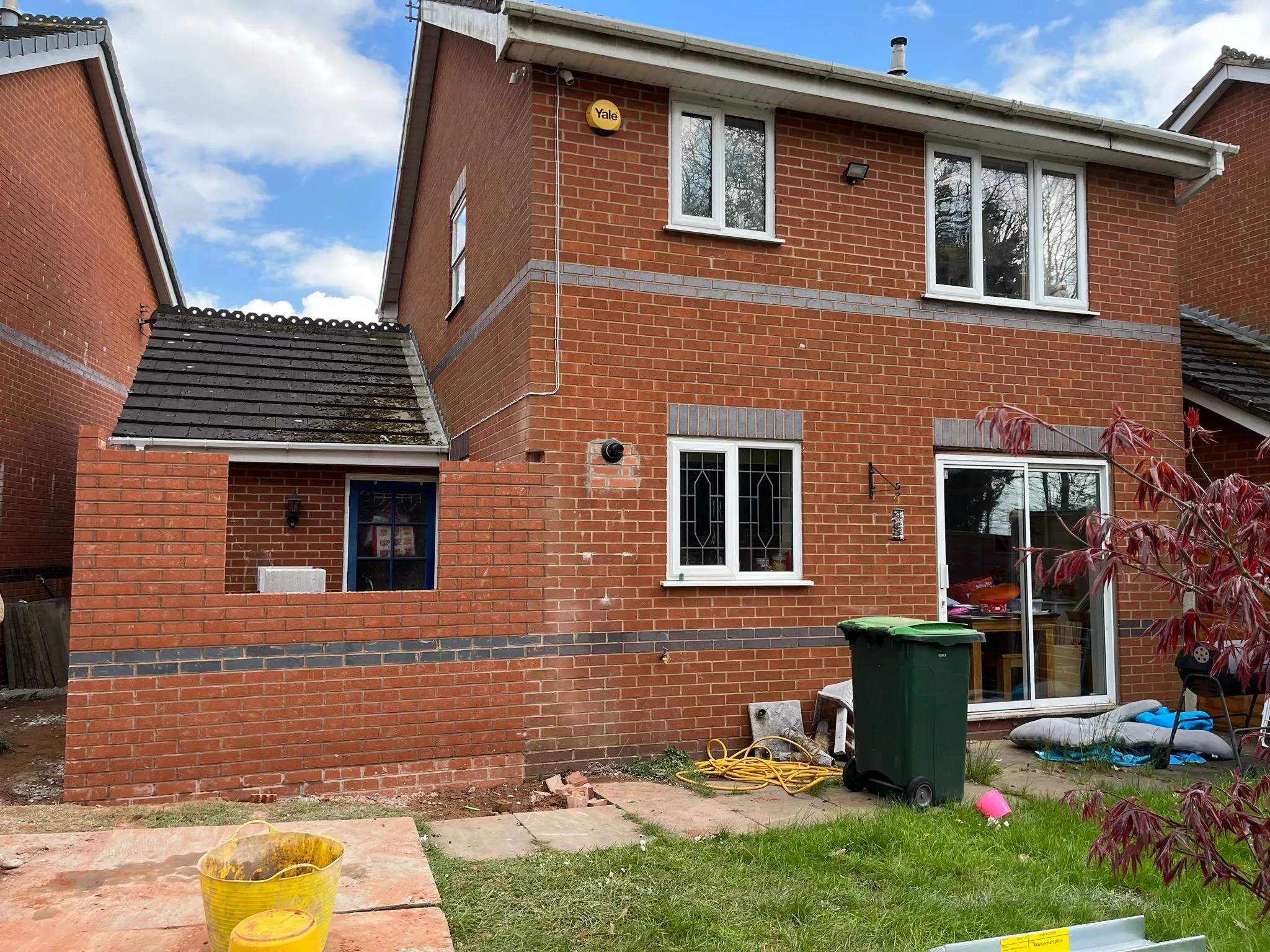 Single-storey home extension under construction on a brick house in Stourbridge.