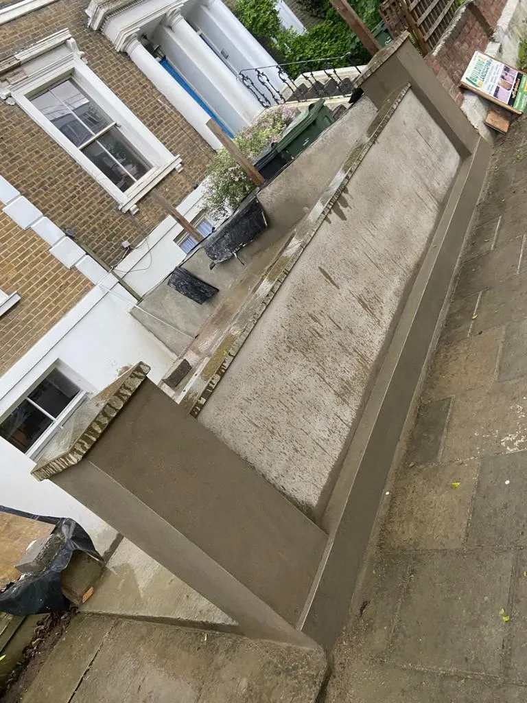 Newly rendered garden wall and pillar as part of a landscaping project by Prestige Home Improvements