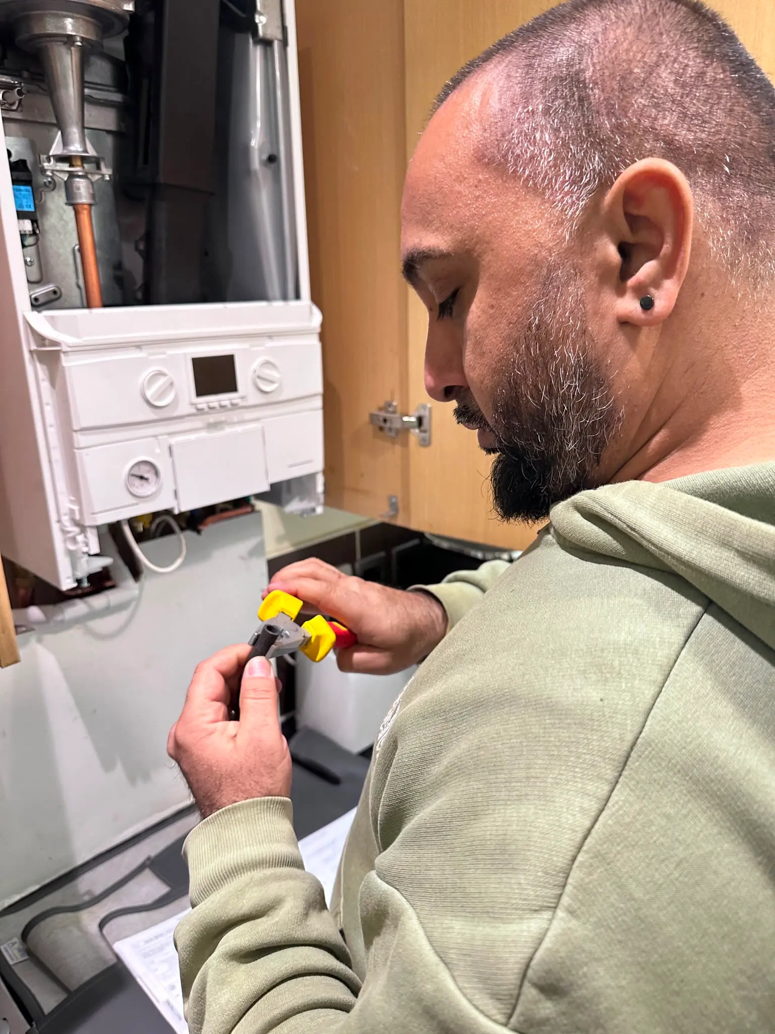 JMA Plumbing & Heating Gas Safe registered engineer repairing a combi boiler in Snodland, Kent