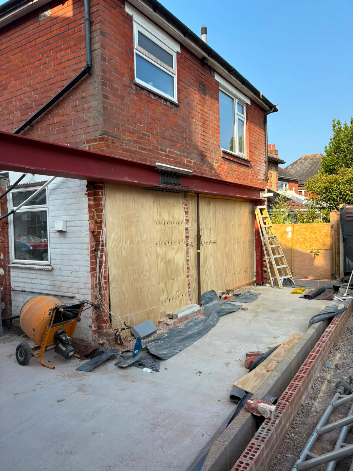 RSJ steel beam installation and groundwork foundations for a rear house extension by Aline Construction