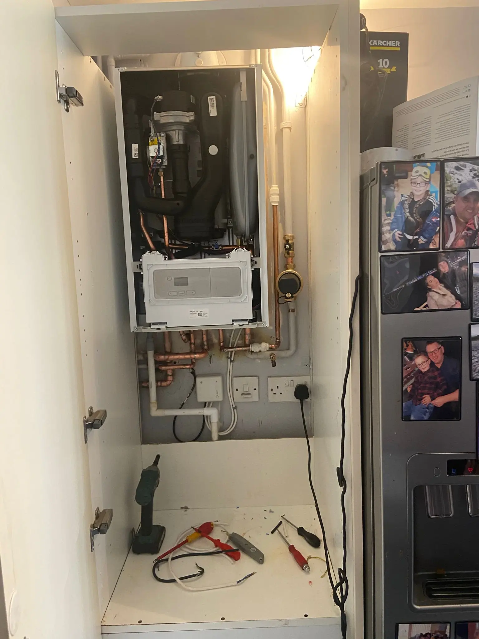 Professional boiler installation or repair in Wolverhampton showing internal components and pipework.