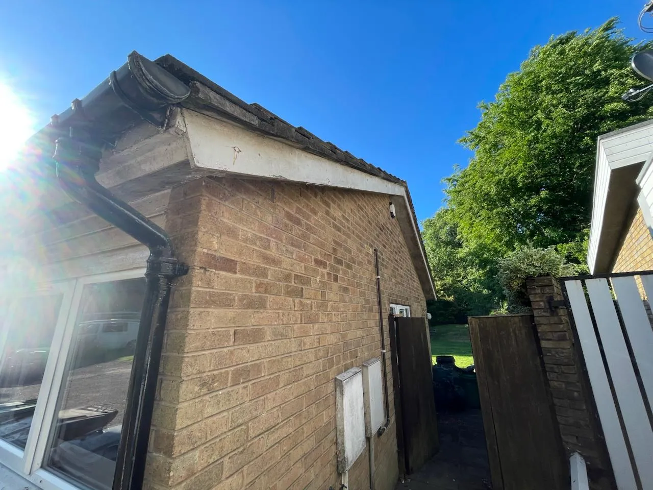 Exterior corner of a domestic property showing high-risk areas like roofline, soffit, and fascias.