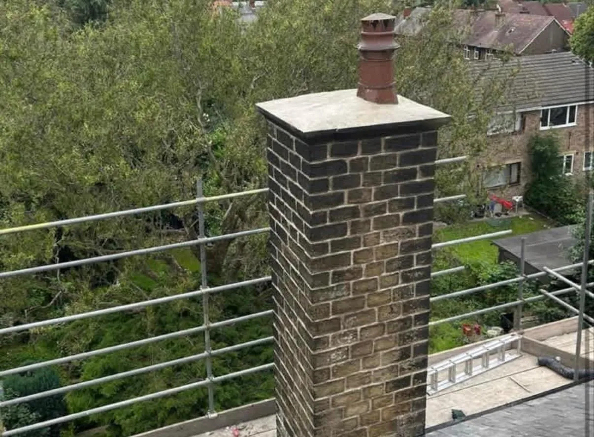 Professional chimney repairs and maintenance being carried out on a residential property in Holmfirth.