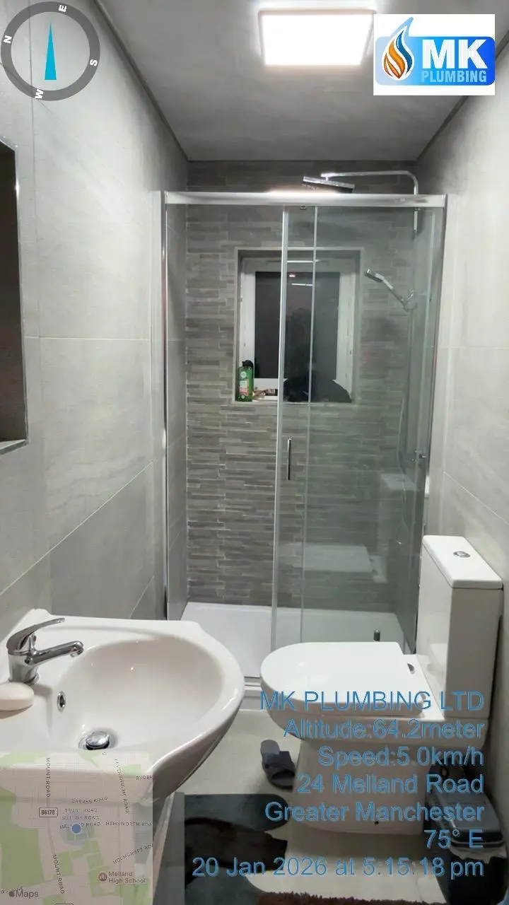 Modern bathroom installation in Greater Manchester by MK Plumbing LTD including shower, toilet, and sink.