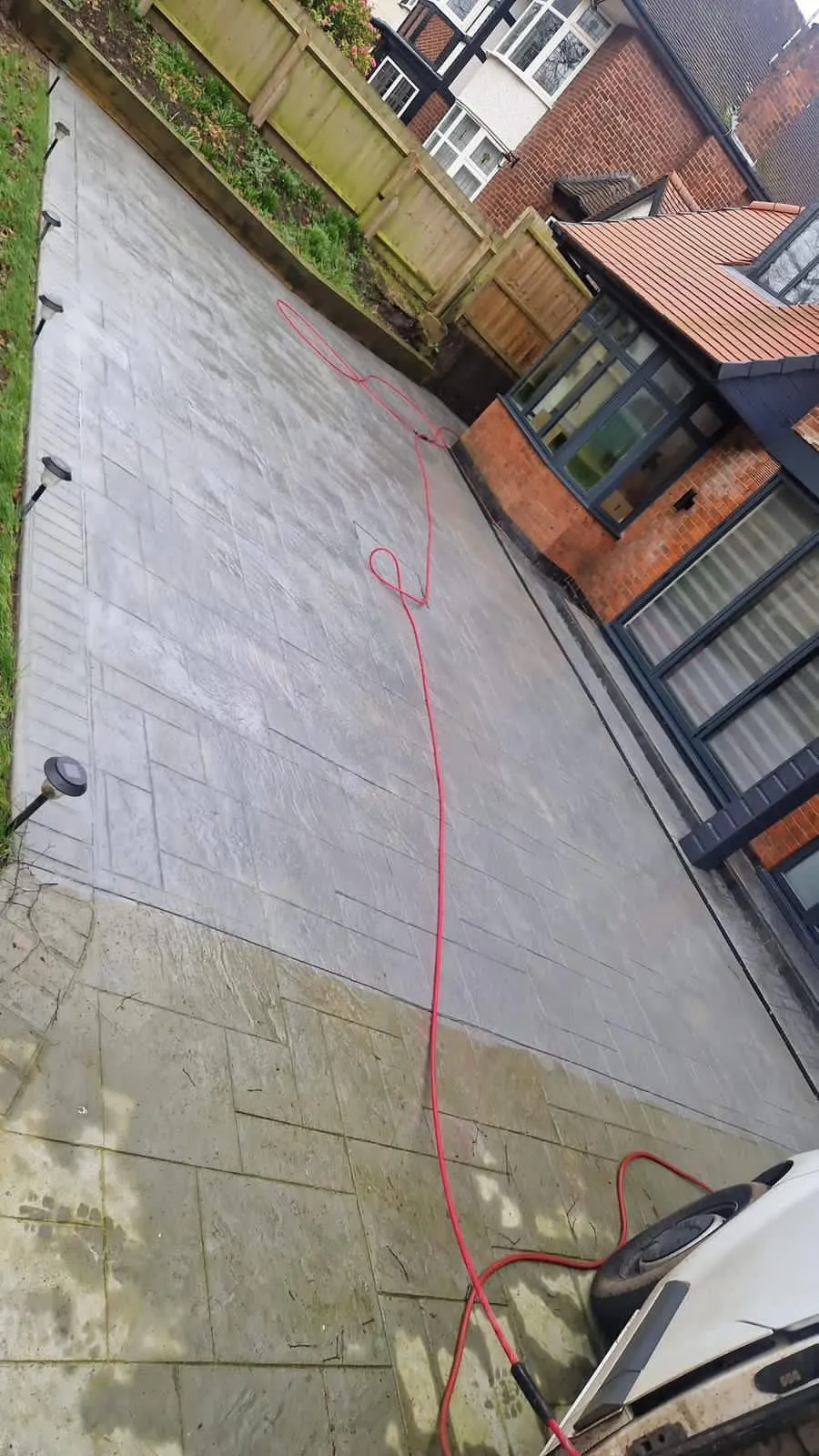 Professional driveway cleaning service in progress by Better Choice Roofing & Cleaning