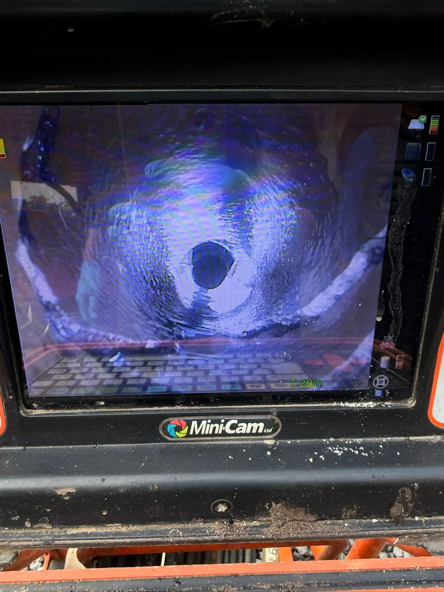 CCTV drain survey monitor displaying a camera inspection inside a drain pipe