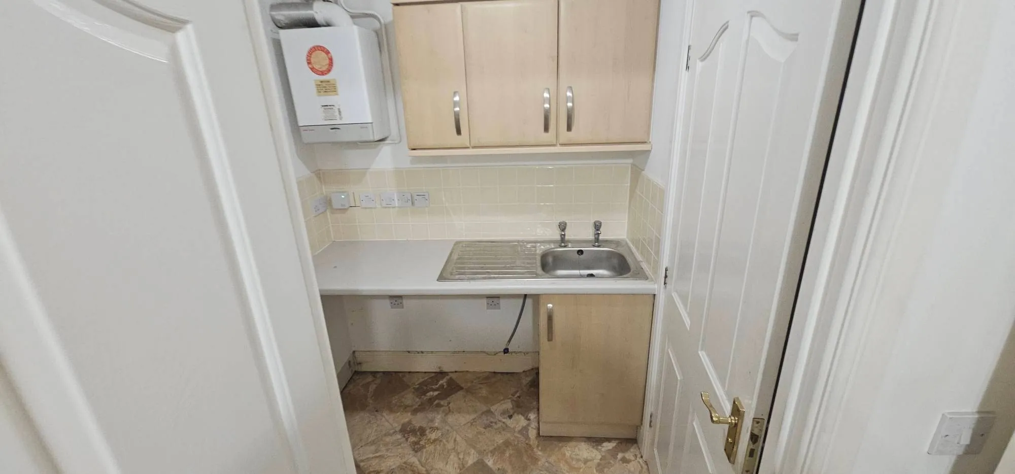 Cleared kitchen and utility space in a Birmingham property after a professional clearance