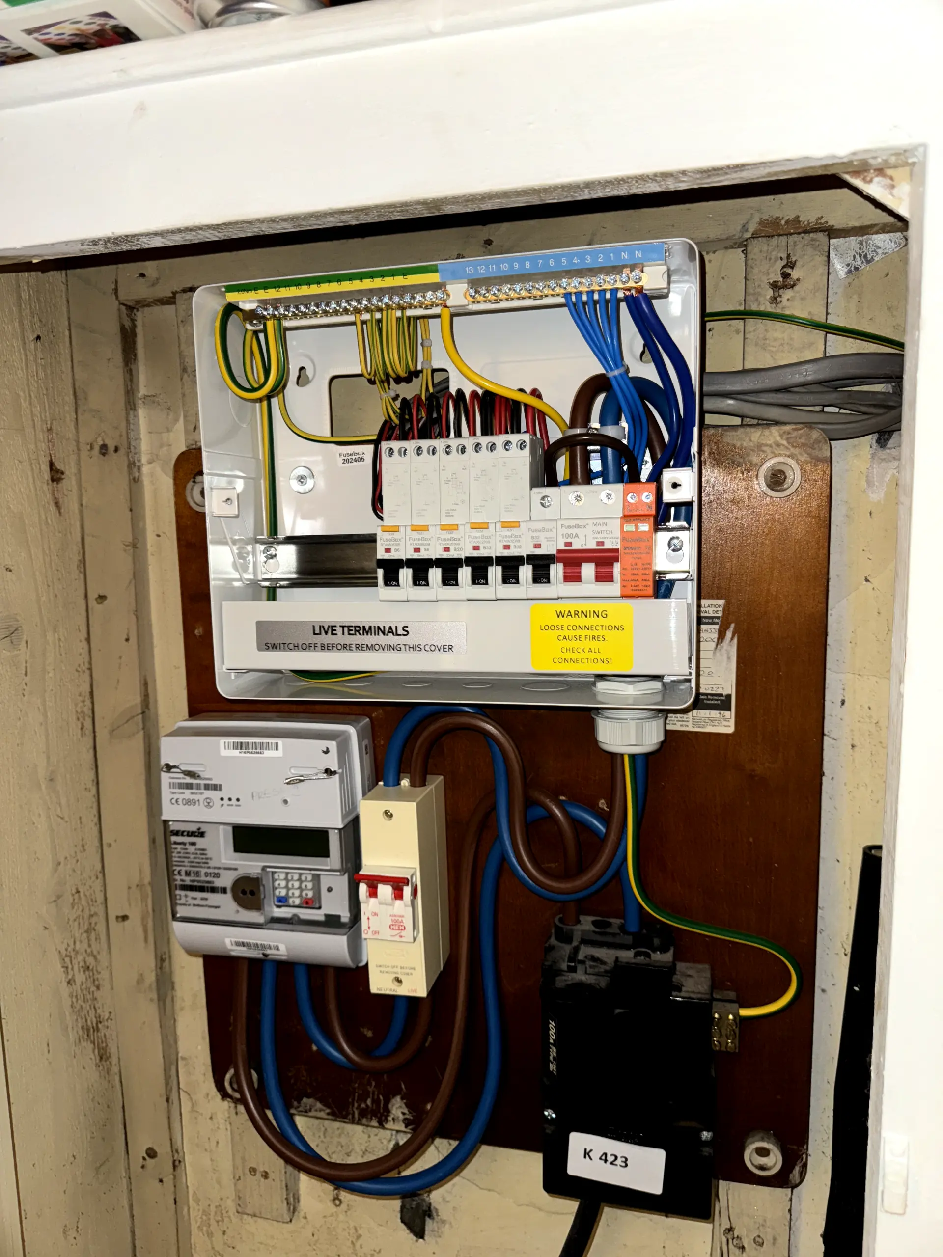Internal view of a newly installed 18th Edition compliant consumer unit showing neat wiring