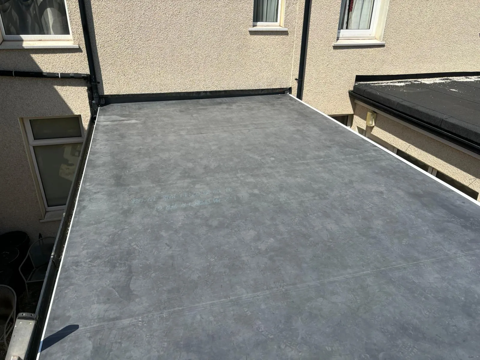 Professional grey EPDM flat roof installation by PRS Roofing in Gloucestershire.